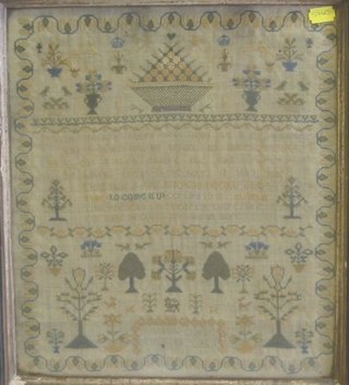 A Victorian wool work sampler by Susannah Clark aged 12 years 1835 with motto and garland, 14" x 12"