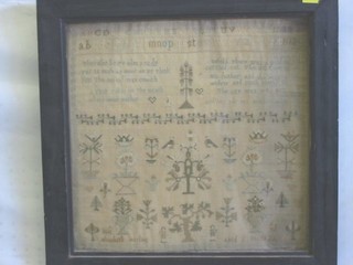 A Victorian wool work sampler by Elizabeth Marlin, aged 12 years 1821 with alphabet, garden and motto, 13" x 13"