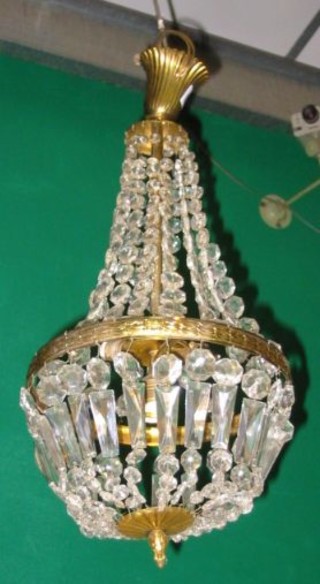 A cut glass electric light fitting