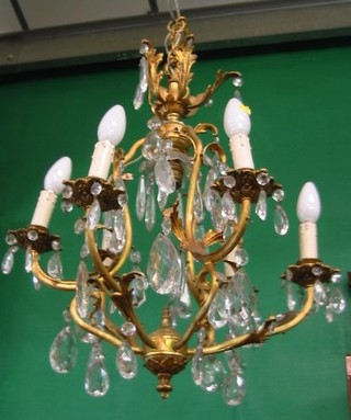 A gilt metal 6 light electrolier with cut glass lozenge drops