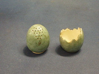 A MacIntyre 2 piece condiment set, the pepper in the form a green glazed egg and the salt in the form of a hatched egg, bases marked MacIntyre Burslem 2"