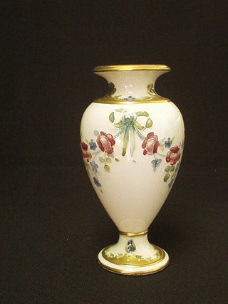 A MacIntyre 18th Century pattern baluster shaped vase, decorated floral garlands and gilt banding, the base with brown MacIntyre mark, marked M2577 and with Moorcroft signature mark 6"