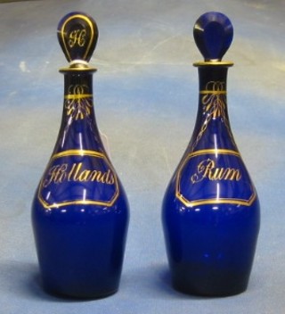 A pair of 19th Century Bristol blue decanters and stoppers Rum and Hollands (Hollands decanter f) 8"