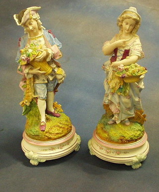 A pair of 19th Century biscuit porcelain figures of a lady and gentleman  (f) 13"