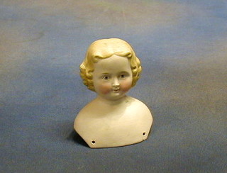 A biscuit porcelain dolls head 4" (cracked)