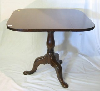 A small Georgian mahogany snap top breakfast table, raised on a baluster turned column and tripod supports 32"