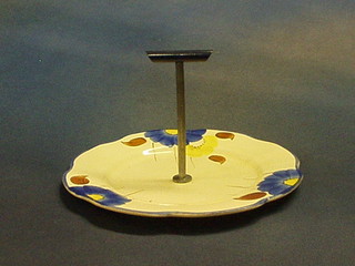 A circular Clarice Cliff style pottery cake stand, the base marked Made in England, 8"