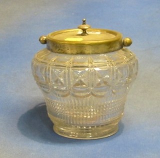 A moulded glass biscuit barrel with silver plated lid