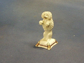 A 19th Century Staffordshire figure of a Poodle on a cushion 3 1/2"