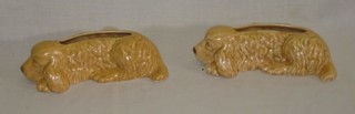 A pair of Sylvac planters in the form of reclining dogs, the base marked 2025 7"