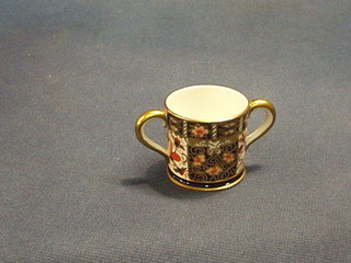 A Crown Derby twin handled miniature porcelain tyg, 2"