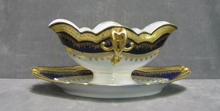 A 19th/20th Century "Sevres" porcelain twin spouted sauce boat with blue and gilt banding