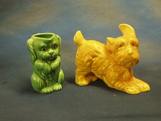 A Sylvac  figure of an orange coloured reclining dog 36" and a Sylvac green glazed jug in the form of a dog, the base marked 45 (2)