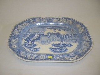 A 19th Century large blue and white pottery lozenge shaped meat plate with parkland decoration 21"