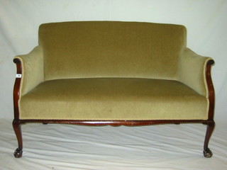 An Edwardian mahogany show frame 2 seat settee upholstered green Dralon and on cabriole, ball and claw supports 51"