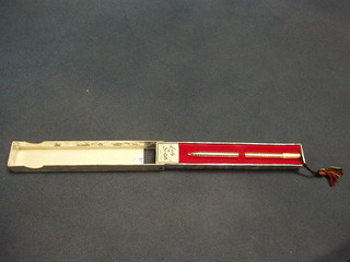 A Scriptos pen contained in a gilt metal case