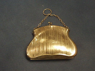 An Edwardian silver plated purse with engine turned decoration