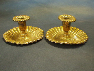 A pair of 19th Century circular reeded silver plated chamber sticks