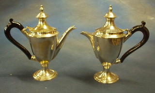A Queen Anne style silver plated coffee pot and matching hotwater jug