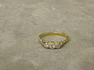 A lady's gold engagement/dress ring set 3 diamonds