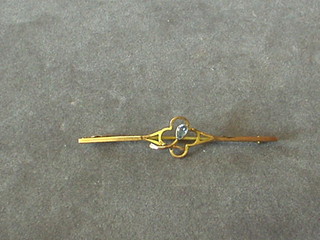 An Edwardian gold bar brooch set a blue stone
