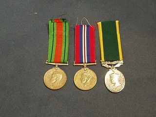 A group of 3 medals to Lieutenant J W H Simmons Royal Berkshire Regt. comprising British War medal, Defence medal and Territorial Efficiency medal