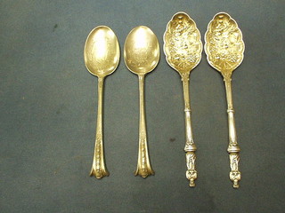 A pair of silver plated berry apostle spoons and 1 other pair of serving spoons