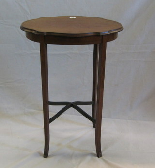 An Edwardian inlaid mahogany oval occasional table, raised on square tapering supports with X framed stretcher 21"