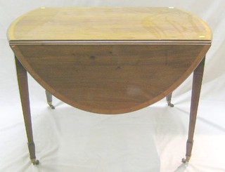 A Sheraton style oval drop flap dining table, raised on square tapering supports ending in spade feet, 42"