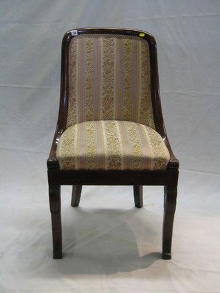 A Regency Empire style tub back chair with upholstered seat, on scrolled supports