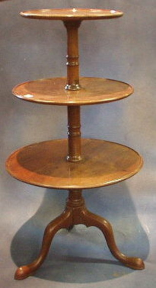 A 19th Century mahogany 3 tier dumb waiter, raised on tripod supports