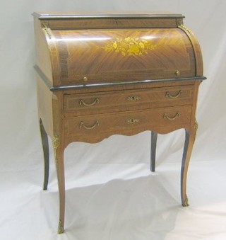 A 20th Century Kingwood and crossbanded cylinder bureau with well fitted interior, fitted 2 long drawers and raised on cabriole supports 29"