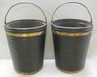 A pair of Georgian style mahogany peat buckets with brass handles