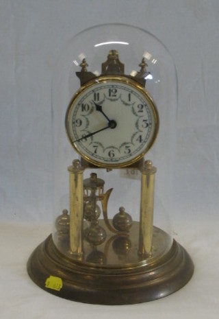 A German 400 day clock with porcelain dial, contained in a gilt case, complete with glass dome