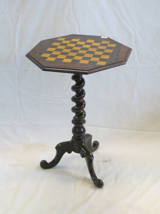 A Victorian rosewood octagonal wine table, the top inlaid a chessboard, raised on a spiral turned pillar with tripod base 19"