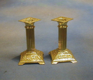 A pair of brass candlesticks 5"