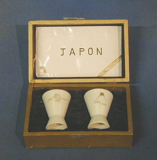 A pair of porcelain presentation sake cups