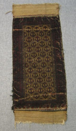 An Afghan saddle bag slip rug with geometric design within multi row borders (some wear) 42" x 18"