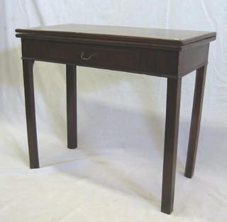 A Georgian mahogany rectangular tea table, fitted a frieze drawer and raised on square chamfered supports 33"