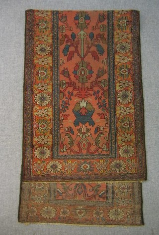 A "Sarouck" pink ground and floral patterned runner 102" x 31"