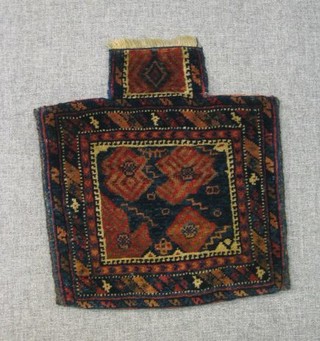 An Eastern saddle bag rug 18" x 19"