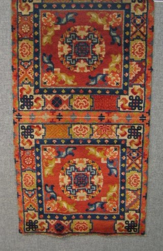 An inner Mongolian woollen rug made up of 4 panels, pink ground with multi-row borders 75" x 26"