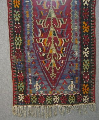 A Kelim rug with stylised tree of life to the centre 63" x 39"