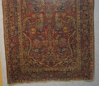 A red ground Bokhara carpet with 10 octagons to the centre 66" x 56"