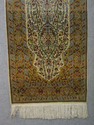 A fine quality "Kaysery" prayer rug with prayer niche and floral borders 53" x 31"