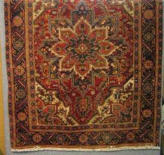 A fine quality Persian rug with medallion to the centre within multi-row borders 73" x 57"