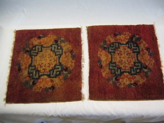 A pair of Mongolian peach coloured panels with floral decoration 15" x 14"