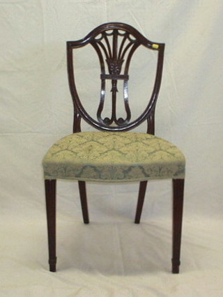 A set of 8 Hepplewhite style camel back dining chairs (2 carvers, 6 standard) with upholstered seats, on square fluted supports
