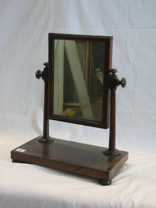 A 19th Century rectangular plate dressing table mirror contained in a mahogany swing frame 14"