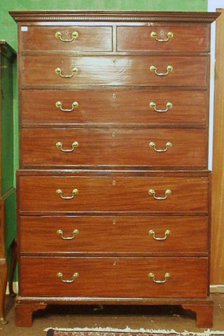 A Georgian mahogany chest on chest with moulded and dentil cornice, the upper section fitted 2 short and 3 long graduated drawers, the base fitted 3 long drawers, raised on bracket feet 48"